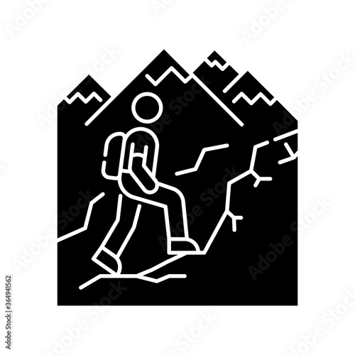 Trekking black glyph icon. Nature tourism, backpacking silhouette symbol on white space. Outdoor recreational activity, challenging hiking trail. Tourist with backpack. Vector isolated illustration