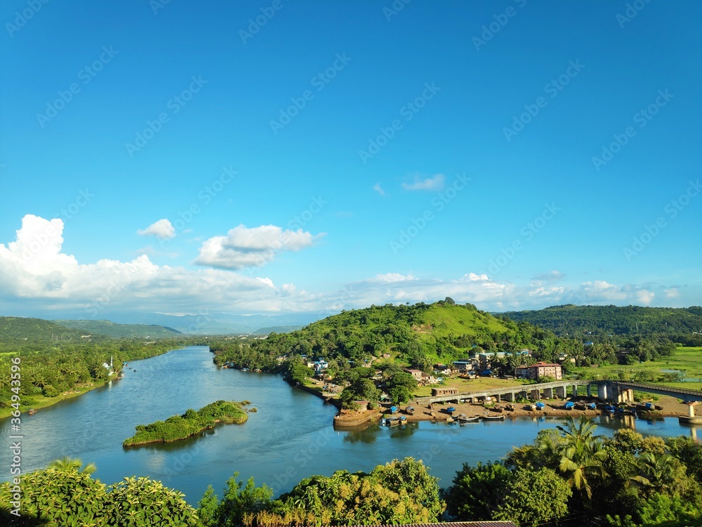 Fototapeta landscape with river and blue sky