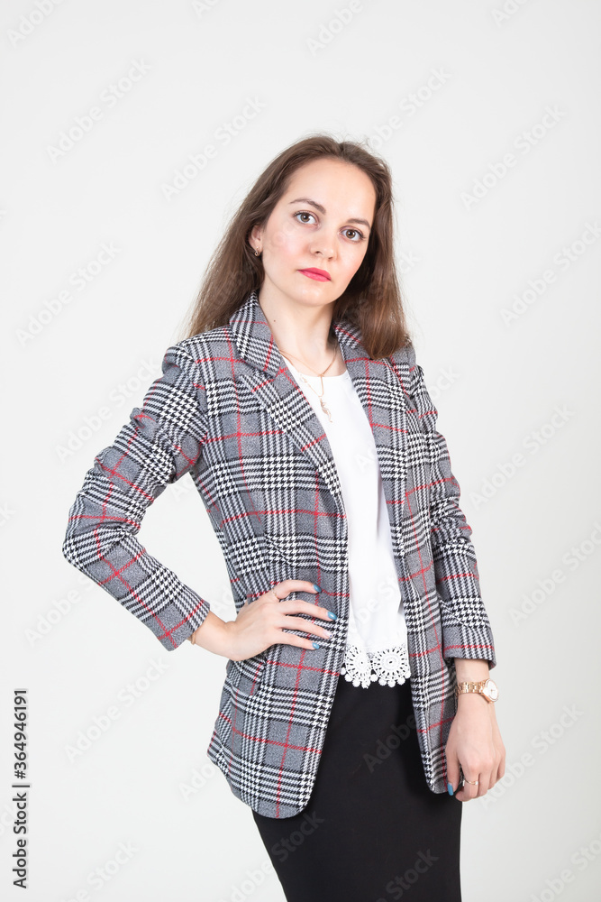 Young beautiful girl on a white background. Presents a business project and is a leading speaker at a business meeting Young beautiful girl on a white background. Presents a business project and is a leading speaker at a business meeting