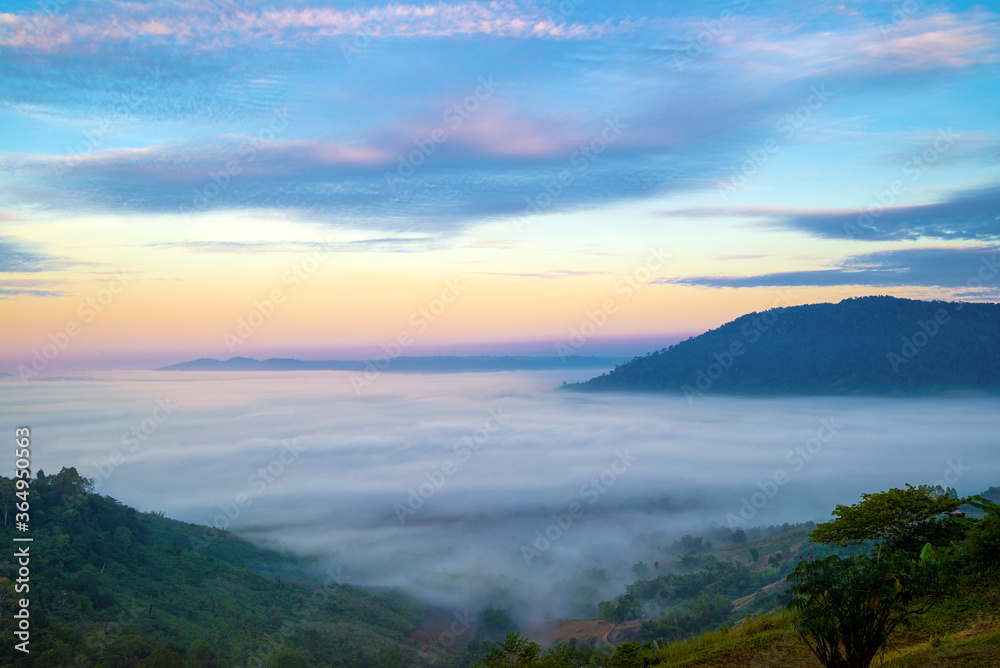 Fototapeta premium Beautiful landscape of mountain misty morning sunrise is the travel destination and famous place at Khao Kho district, Phetchabun province, Thailand. Relaxation with the natural
