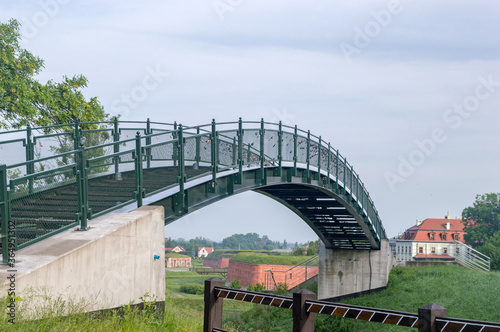 Fototapet Pedestrian bridge over railway track in Zamosc.