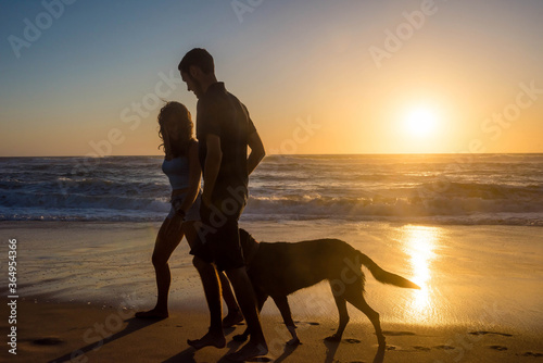 young couple in love in the evening on the beach