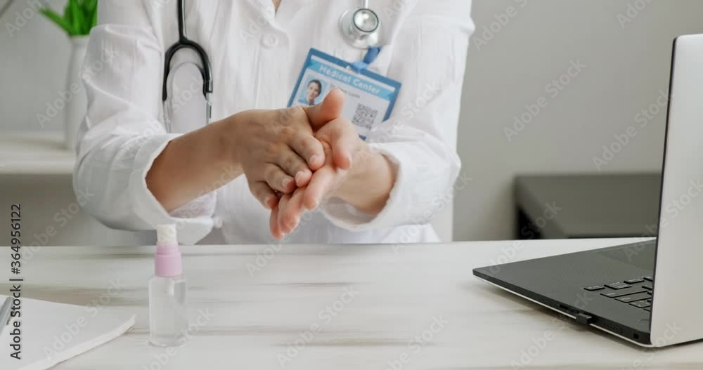 Doctor talking to patient using virtual chat computer app. Female medical Therapist wears medical gown, headset video calling distant patient on laptop. Telemedicine remote healthcare services concept Doctor talking to patient using virtual chat computer app. Female medical Therapist wears medical gown, headset video calling distant patient on laptop. Telemedicine remote healthcare services concept