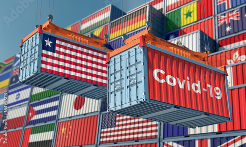 Container with Coronavirus Covid-19 text on the side and container with Liberia Flag. Concept of international trade spreading the Corona virus. 3D Rendering © Marius Faust