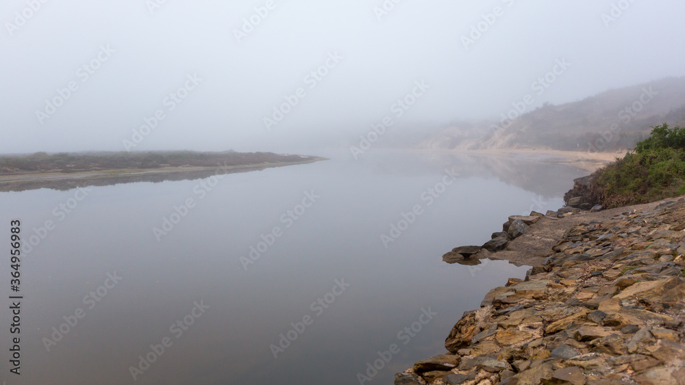 A very calm onkaparinga river with a heavy morning fog in port noarlunga south australia on july 14 2020 A very calm onkaparinga river with a heavy morning fog in port noarlunga south australia on july 14 2020