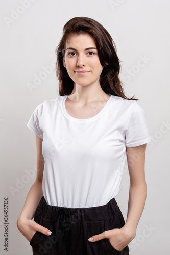 Confident woman portrait. Female success. Independent relaxed lady isolated on neutral background.