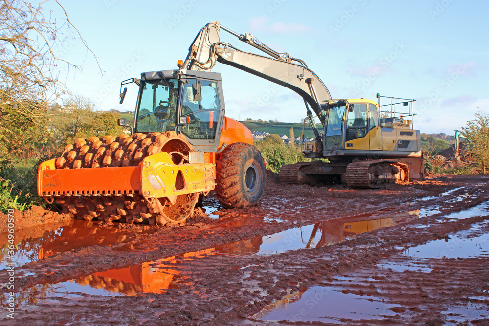 Compactor on a road construction site Compactor on a road construction site