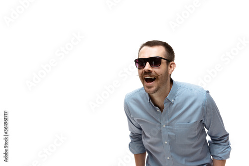 Rich laugh. Young caucasian man with funny, unusual popular emotions and gestures isolated on white studio background. Human emotions, facial expression, sales, ad concept. Trendy look inspired by