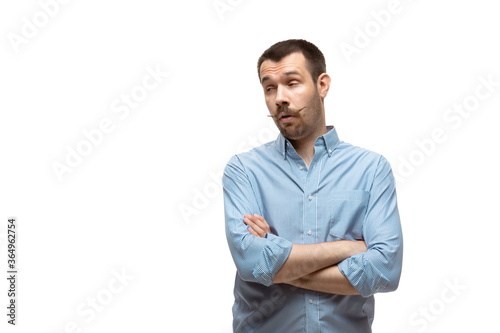 Bored, sceptical. Young man with funny, unusual popular emotions and gestures isolated on white studio background. Human emotions, facial expression, sales, ad concept. Trendy look inspired by memes. © master1305