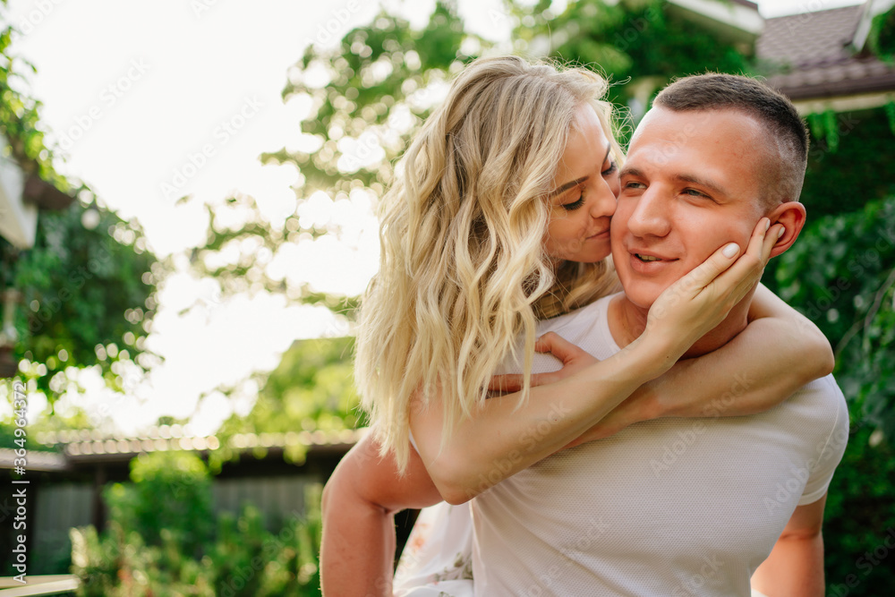 Fototapeta premium beautiful and happy couple having fun in garden.