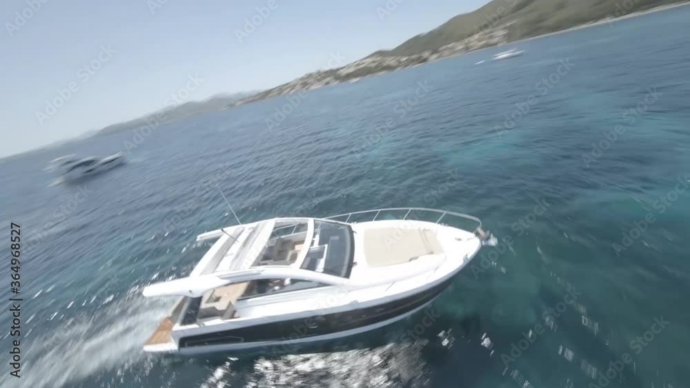 Drone shoot approaching motor boat