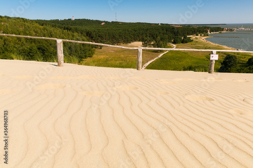 The dunes in Lithuania on Curonian Spit. Gold hot sand, green grass, pine forest. Incredible loose clean sand. 