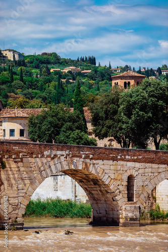 Slika na platnu Stone bridge ponte petra aver the adige river