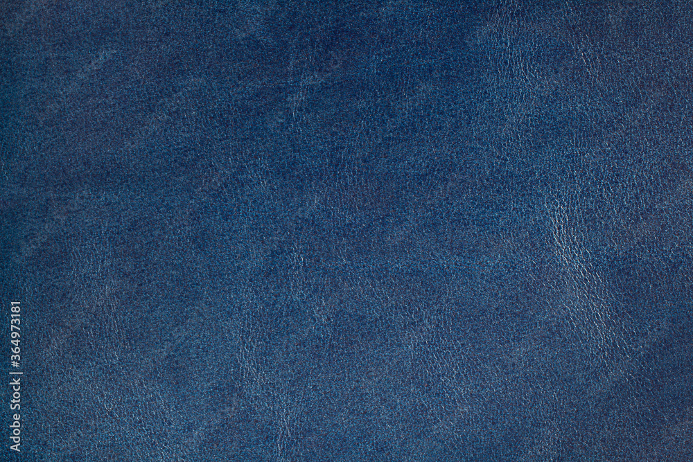 Genuine leather texture dark blue color. Leather surface. Close up. Copy space. Genuine leather texture dark blue color. Leather surface. Close up. Copy space.