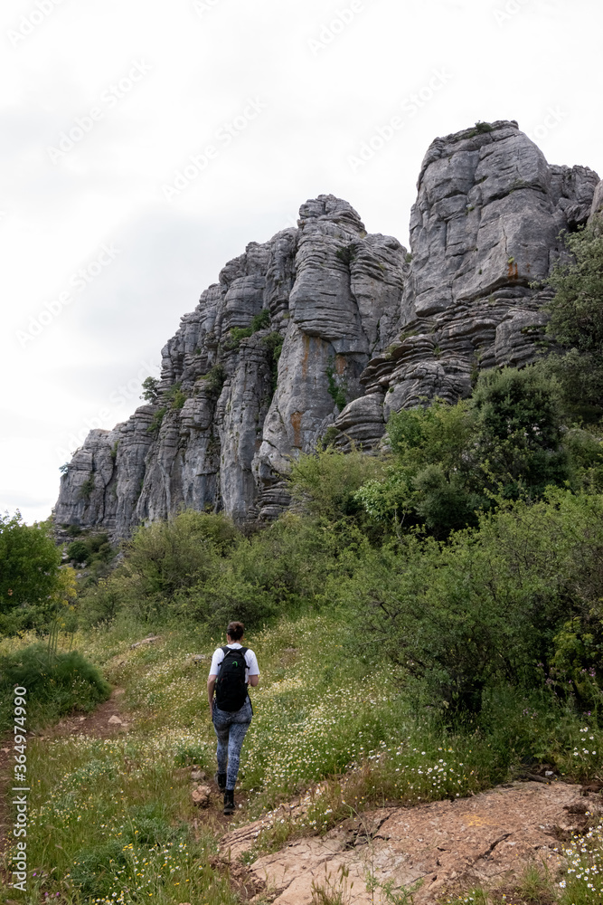 woman walking in rocky mountains