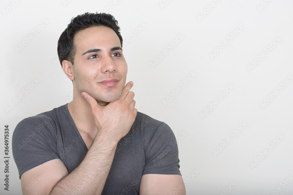Portrait of young handsome man against white background Portrait of young handsome man against white background