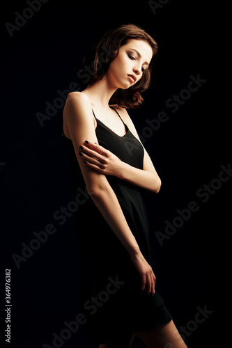 posing in black dress