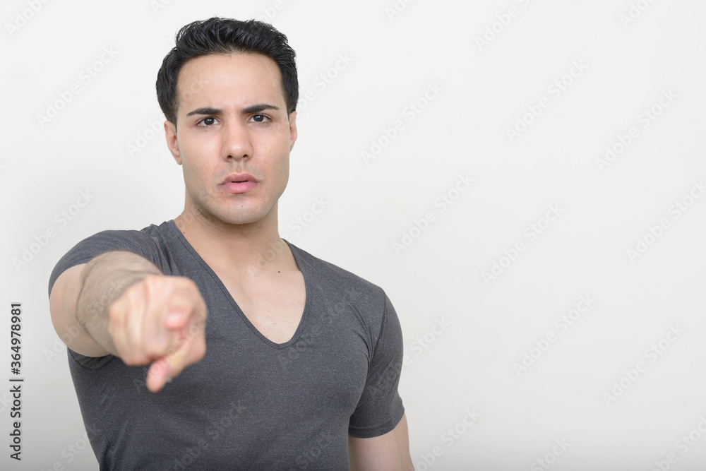 Portrait of young handsome man against white background Portrait of young handsome man against white background