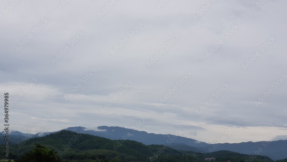 time lapse clouds over mountain