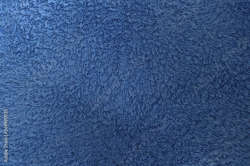 Blue fabric. Texture of a towel terry cloth or terry textile background