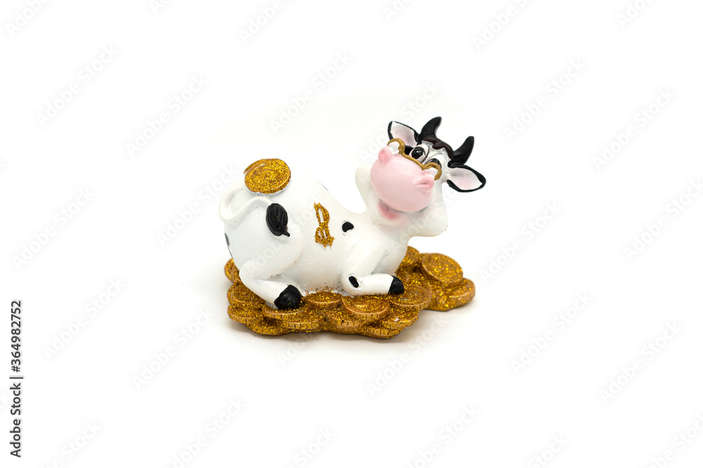 Ceramic toy cow isolated on a white background