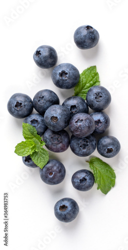 Blueberry fruit top view isolated on a white background, flat lay overhead layout with mint leaf, healthy design concept.