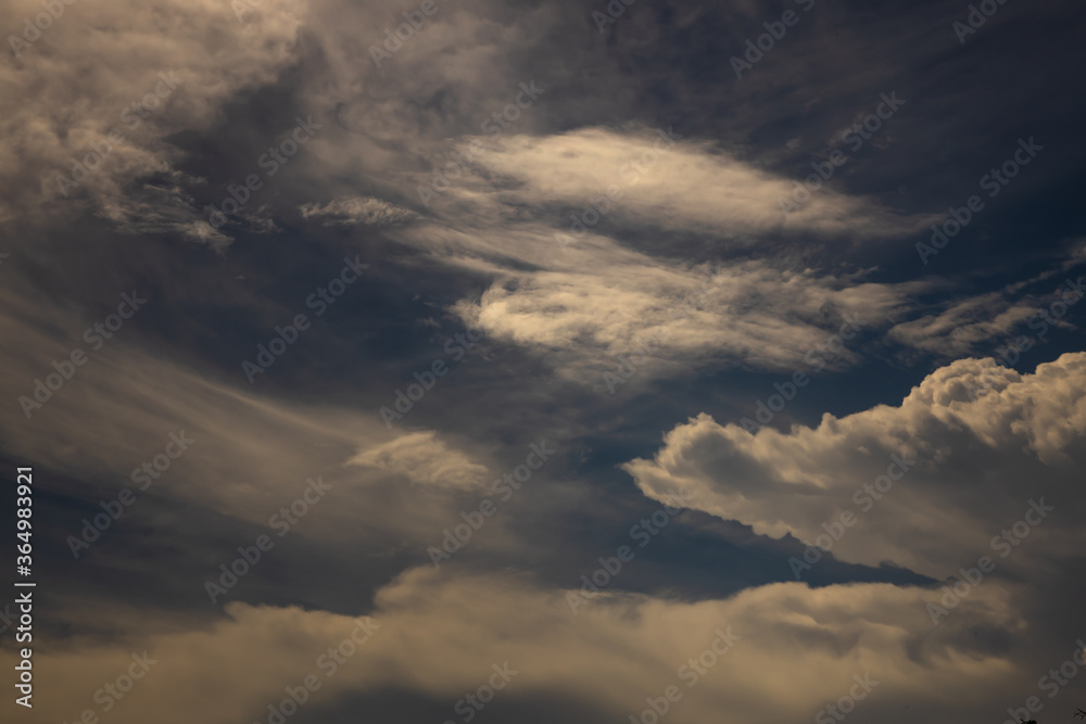 sunshine and white fluffy clouds in the blue sky .blue sky background with tiny clouds