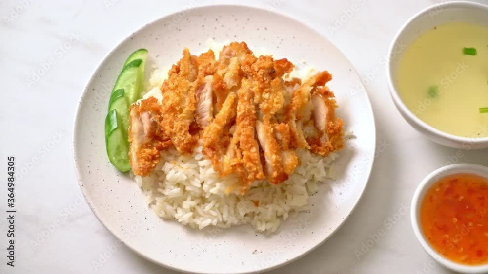 Hainanese chicken rice with fried chicken or rice steamed chicken soup with fried chicken - Asian food style Hainanese chicken rice with fried chicken or rice steamed chicken soup with fried chicken - Asian food style