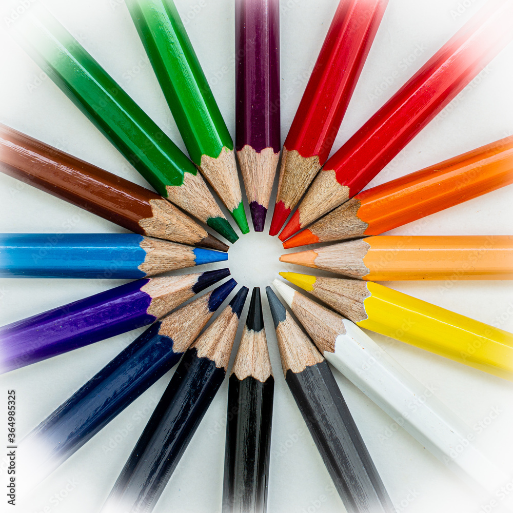 Fototapeta premium colored pencils circle on white background