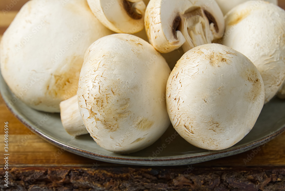 Fresh champignon mushrooms macro shoot. Close-up white sliced champignon.