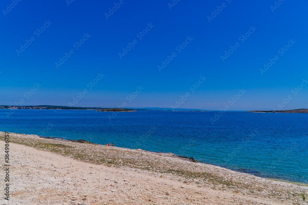 Wild stone beach on the coast of Kamenjak National Park in Premantura, Istria, Croatia