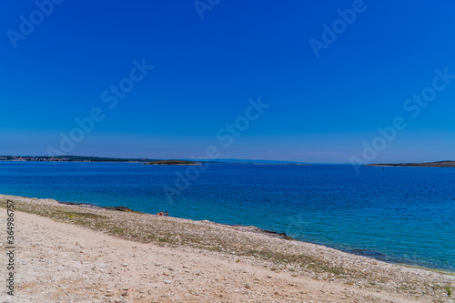 Wild stone beach on the coast of Kamenjak National Park in Premantura  Istria  Croatia