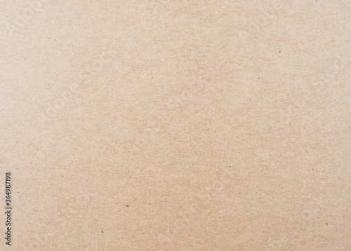 Abstract brown recycled paper craft texture background. 
Old Kraft box paper pattern seamless. 
top view.  