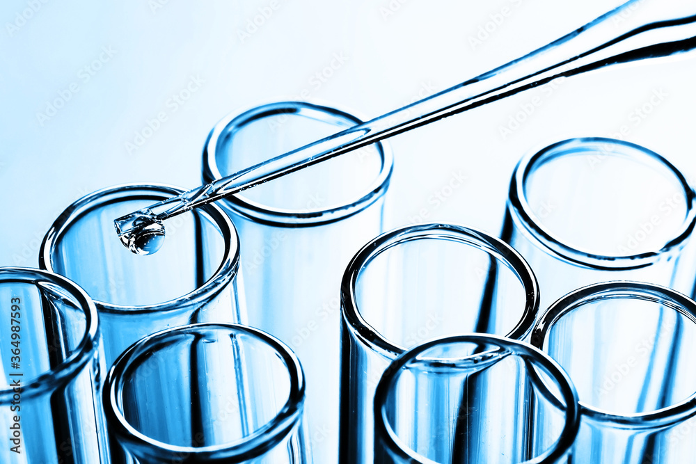 Laboratory test tube background. Covid-19 corona virus pandemic crisis. Glass pipette fluid drop. Global disease problem. Vaccine research science texture. Shiny crystal glass isolated on white. Laboratory test tube background. Covid-19 corona virus pandemic crisis. Glass pipette fluid drop. Global disease problem. Vaccine research science texture. Shiny crystal glass isolated on white.