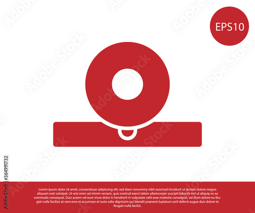 Red Otolaryngological head reflector icon isolated on white background. Equipment for inspection the patient's ear, throat and nose. Vector Illustration.