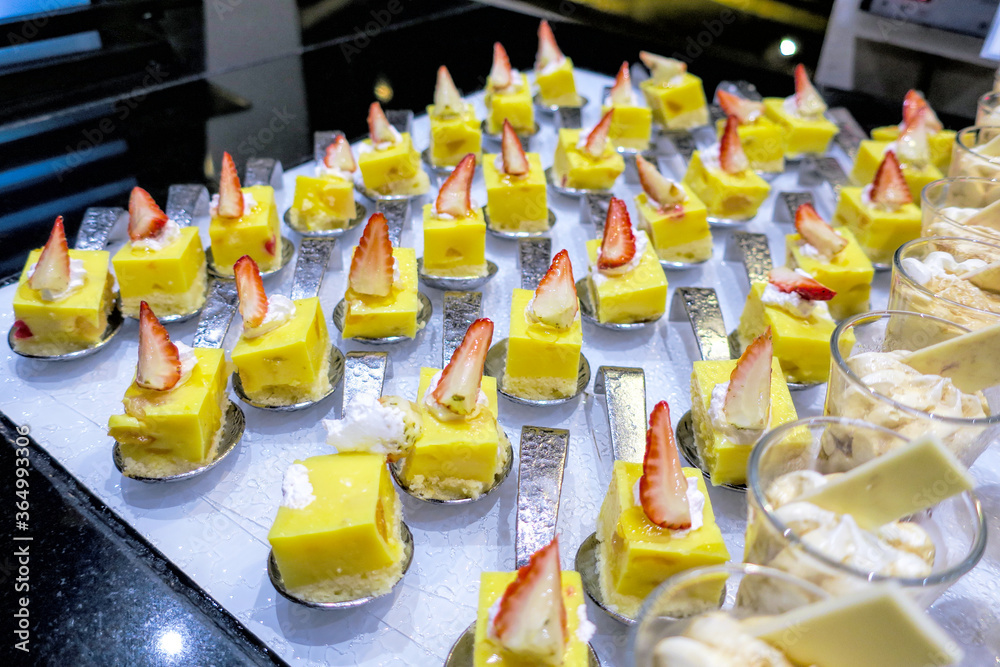 Various buffet cakes in a restaurant for dinner. Food concept. Various buffet cakes in a restaurant for dinner. Food concept.