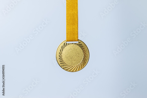 Фотография Gold medal on white background concept for winning or success
