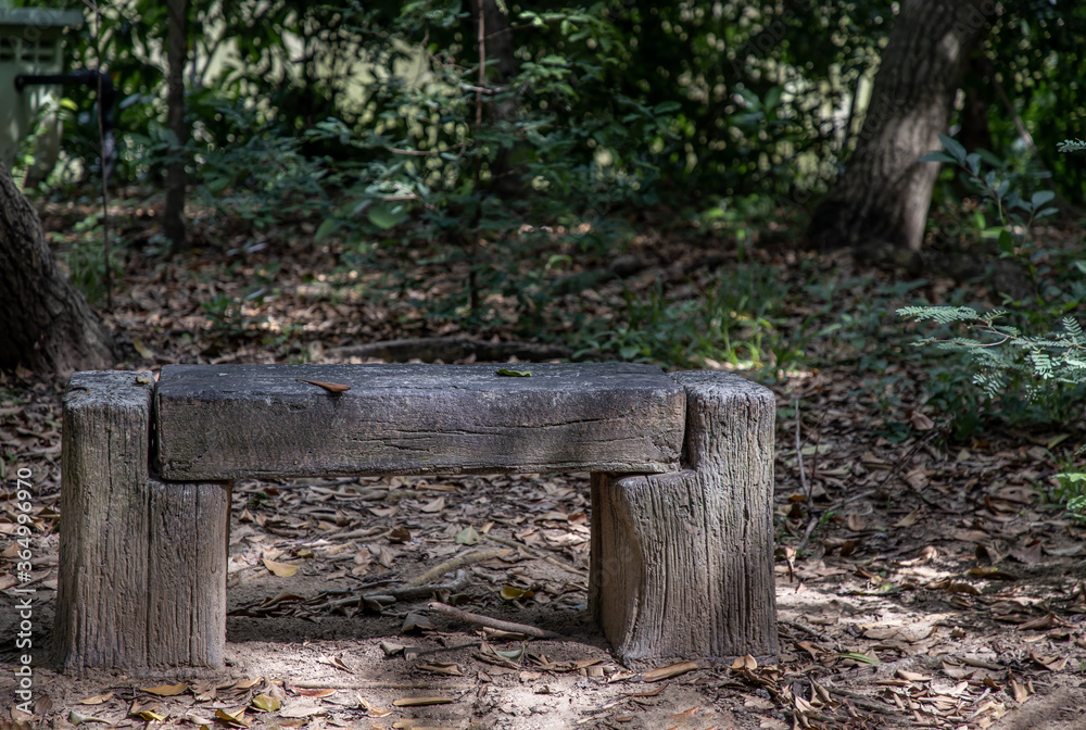 Old wooden benches for relaxation in a park. Concept of rest. Old wooden benches for relaxation in a park. Concept of rest.