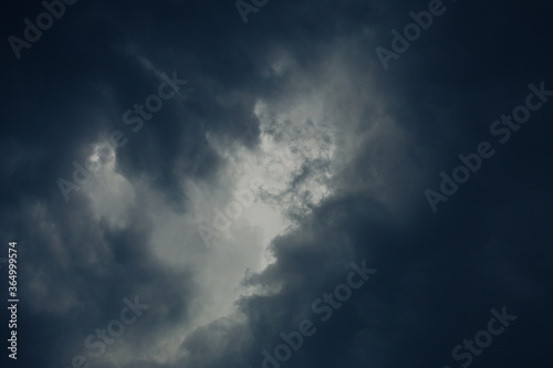 dark sky. Light in the dark and dramatic storms clouds