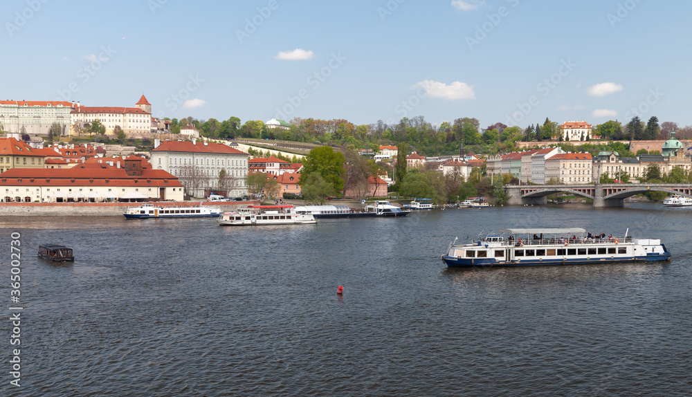 Tourist boats are on Vltava river, Prague