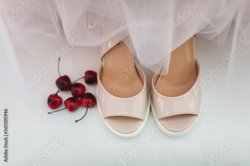 Pink wedding shoes on the floor