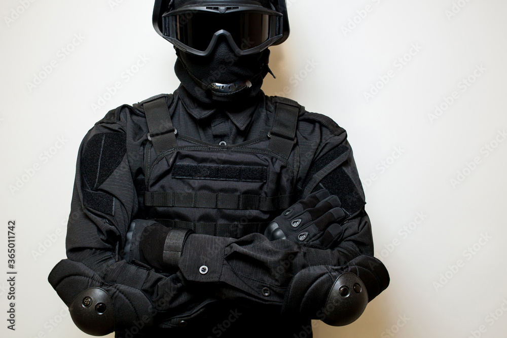 SWAT in black uniform, face mask and bulletproof vest. Russian special ...