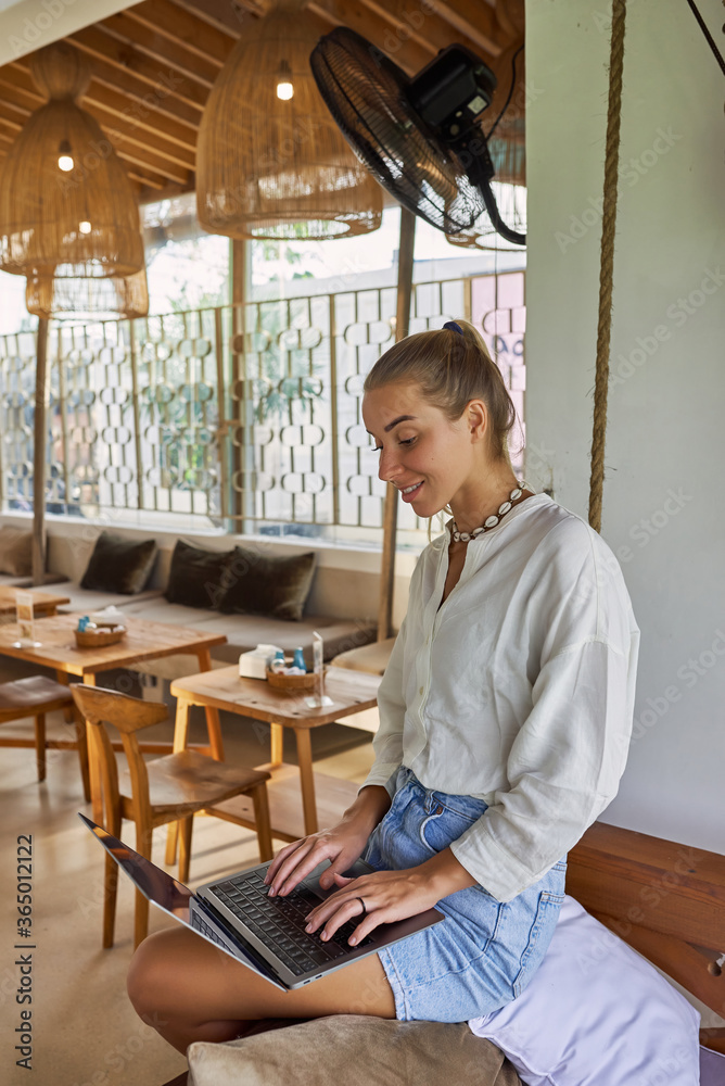 Photo of a beautiful young blonde girl at a computer. Photo of a beautiful young blonde girl at a computer.