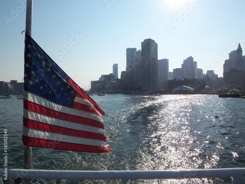 American Flag with Boston Massachusetts city skyline from the water 2008