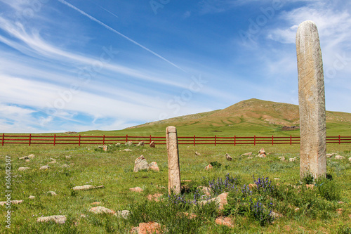 Standing deer stones on a Mongolian hill photo