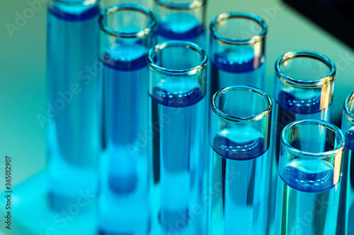 Laboratory test tubes with blue liquid close up