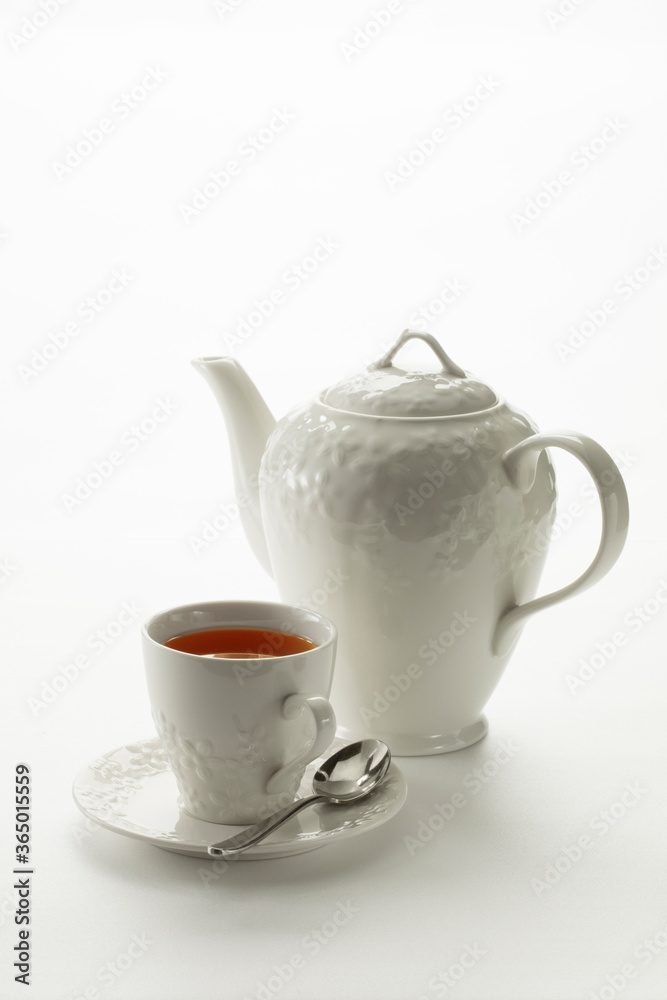 Close up view of china teapot and cup on white background Close up view of china teapot and cup on white background
