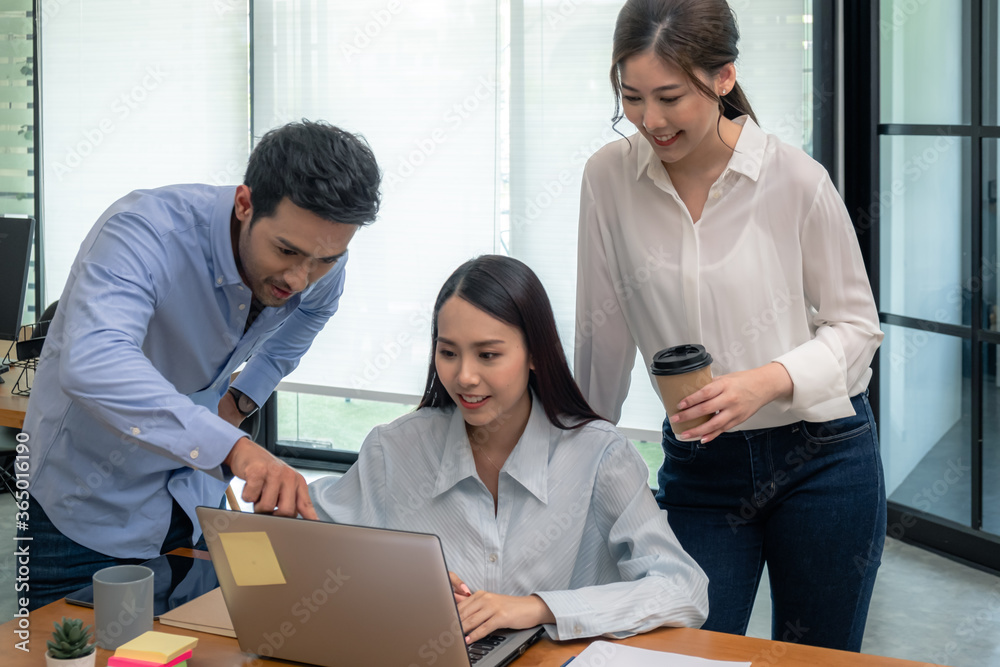 Young business group explaining new business ideas to peers. Business people discussing in meeting room. Young business group explaining new business ideas to peers. Business people discussing in meeting room.