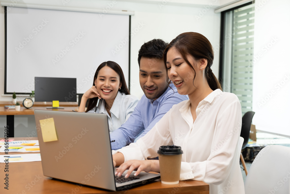 Young business group explaining new business ideas to peers. Business people discussing in meeting room. Young business group explaining new business ideas to peers. Business people discussing in meeting room.