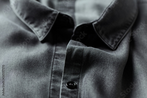 Close up of dark Men's shirt.